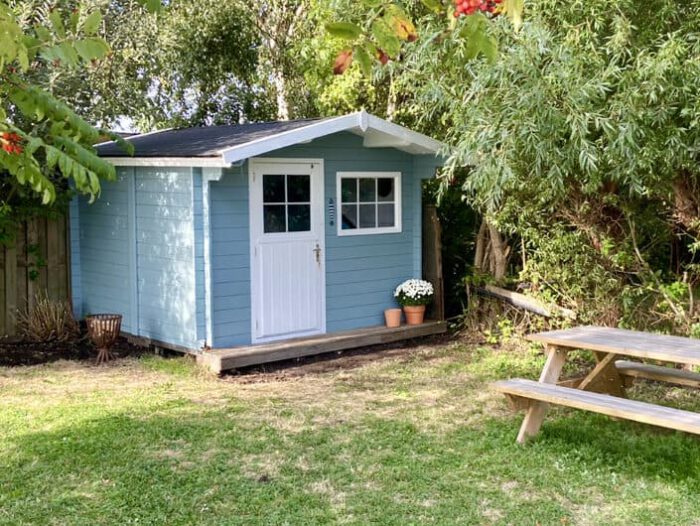 paint garden house in Swedish blue