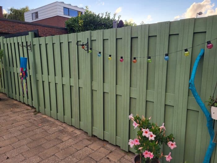 pine fence painted green